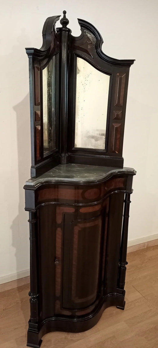 Magnifique meuble d'angle en excellent état, avec plateau miroir et corps inférieur incurvé en bois foncé.