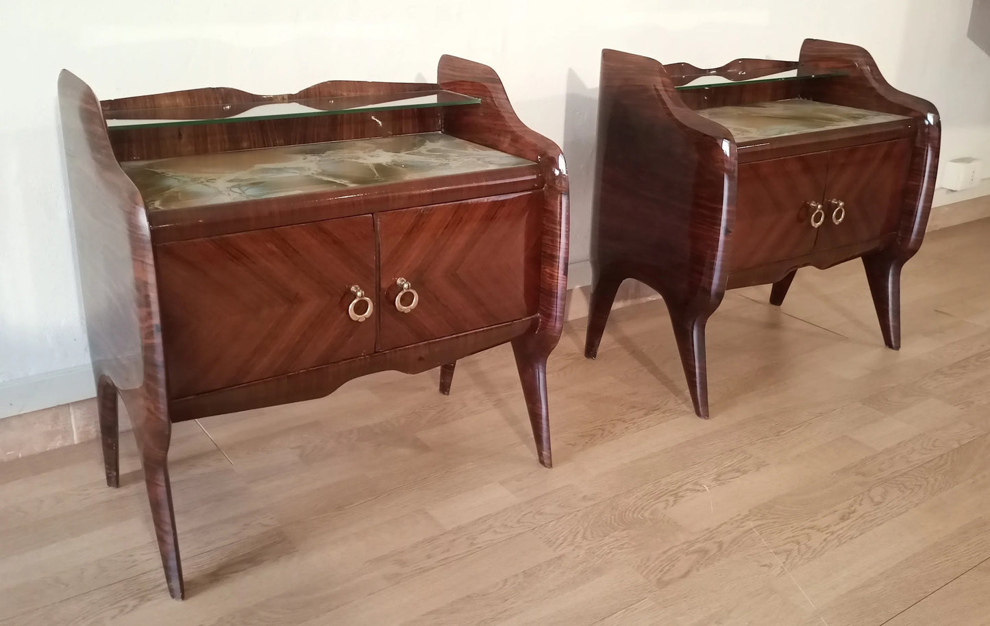 Pair of vintage mahogany bedside tables with curved legs and brass handles in mid-century modern italiano design